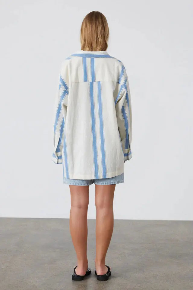 Back View of Marine Stripe Organic Cotton Shirt Zulu & Zephyr at cloth in brick