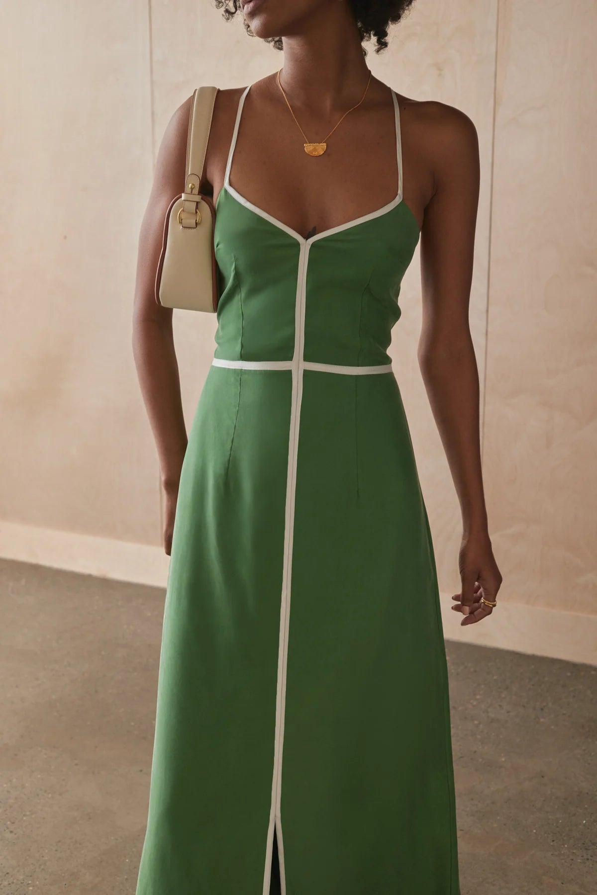 Sancia Isobel Dress - Matcha at cloth in brick front view close up