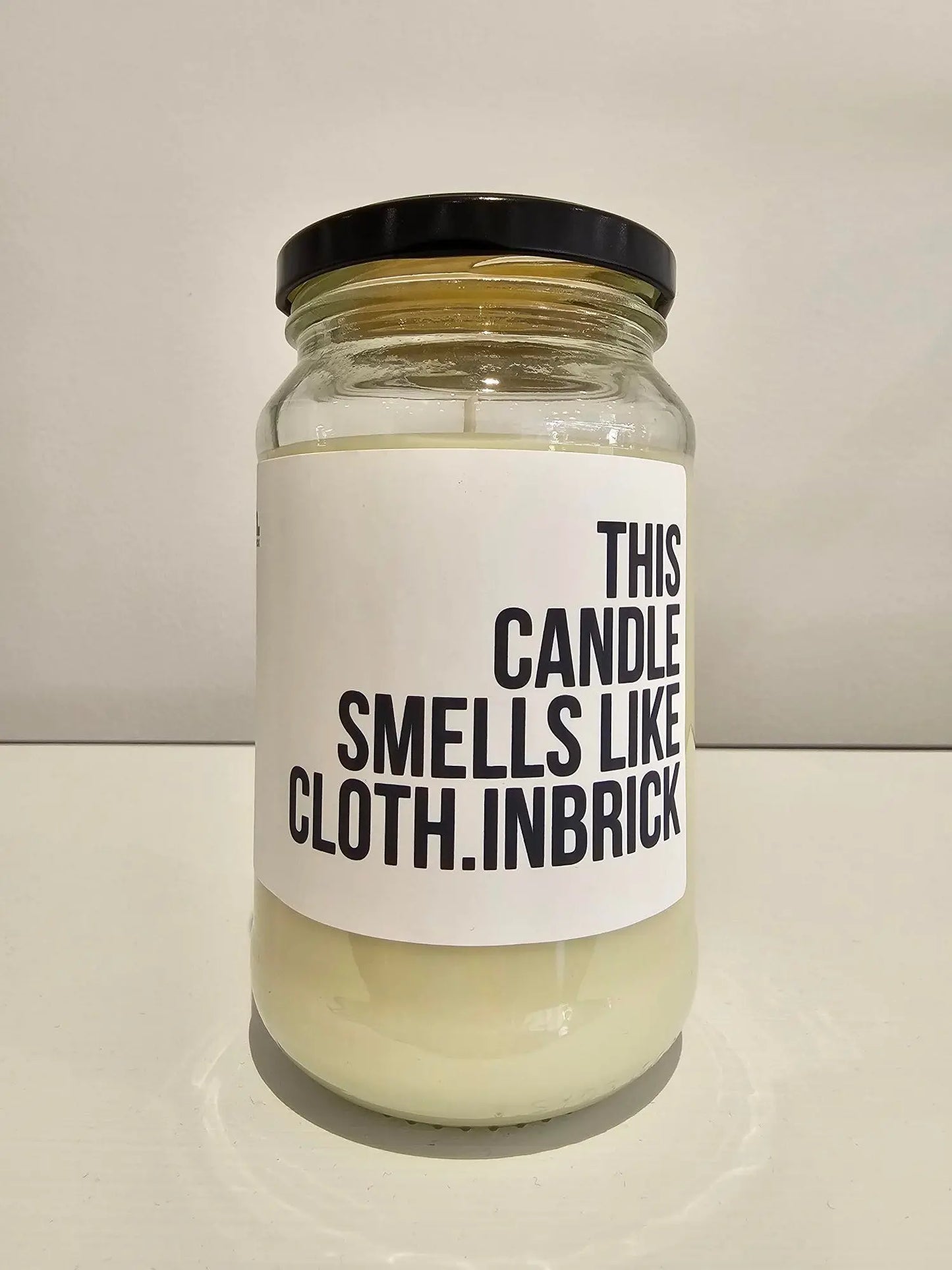 This Candle Smells like cloth.INBRICK Candle cloth.IN BRICK
