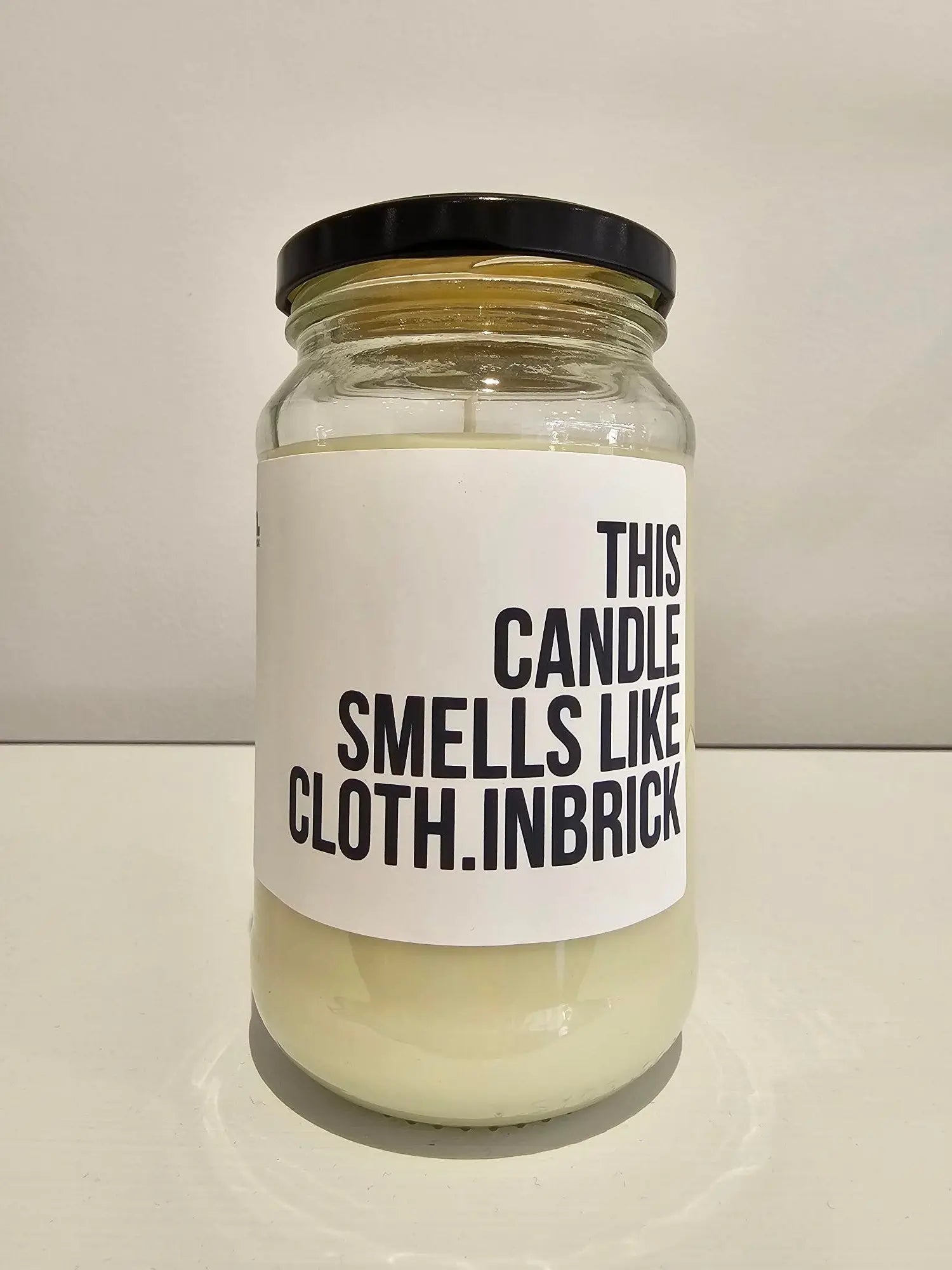 This Candle Smells like cloth.INBRICK Candle cloth.IN BRICK